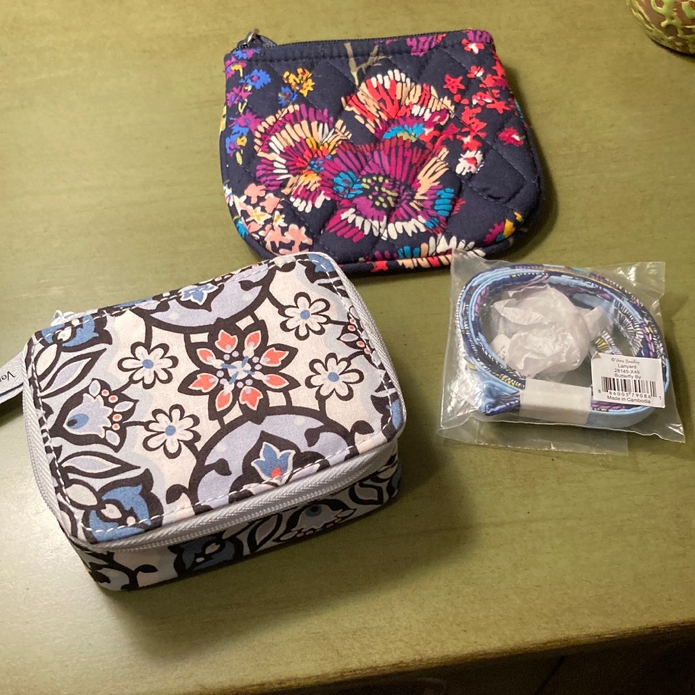 VERA BRADLEY. Assorted variety. There is a lanyard, a coin purse, and a box type